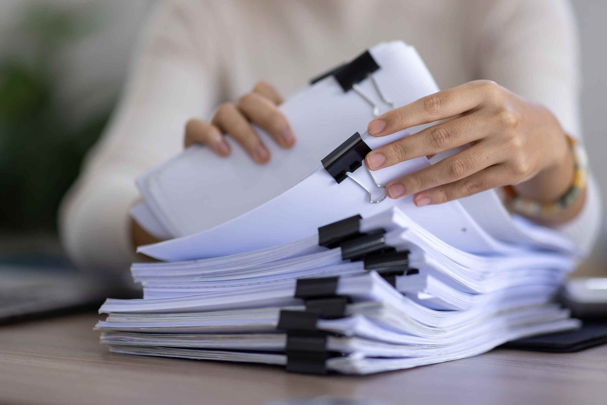Woman looking through ACA Documents